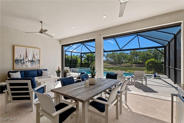 view of patio / terrace featuring a ceiling fan, a pool with connected hot tub, glass enclosure, an outdoor living space with a fire pit, and outdoor dining area