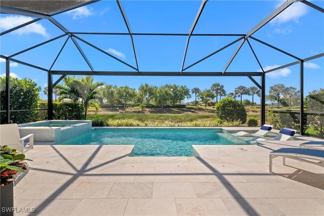 view of swimming pool with glass enclosure, a pool with connected hot tub, and a patio area