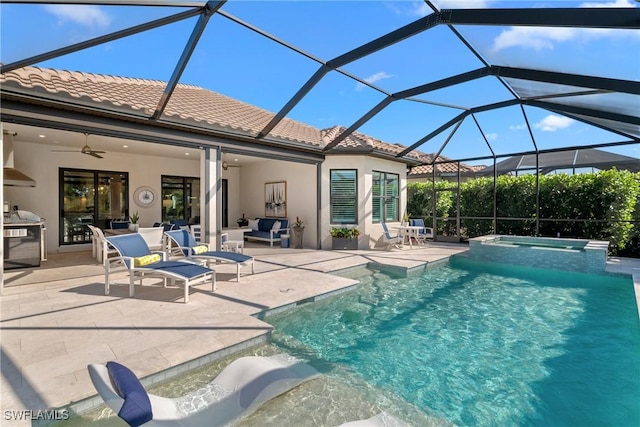view of swimming pool with an outdoor hangout area, a patio area, a lanai, ceiling fan, and a pool with connected hot tub