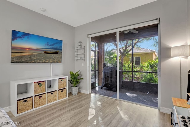 interior space with light wood finished floors and baseboards