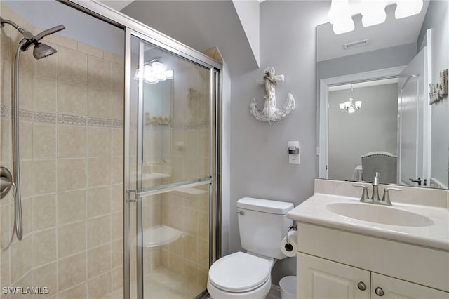 full bathroom with visible vents, toilet, vanity, and a shower stall