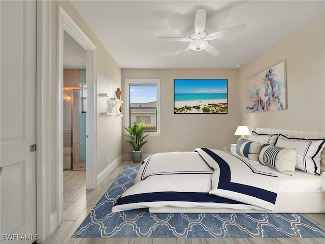 bedroom with wood finished floors, a ceiling fan, and baseboards