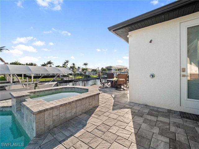 view of swimming pool featuring a water view, an in ground hot tub, outdoor dining space, and a patio