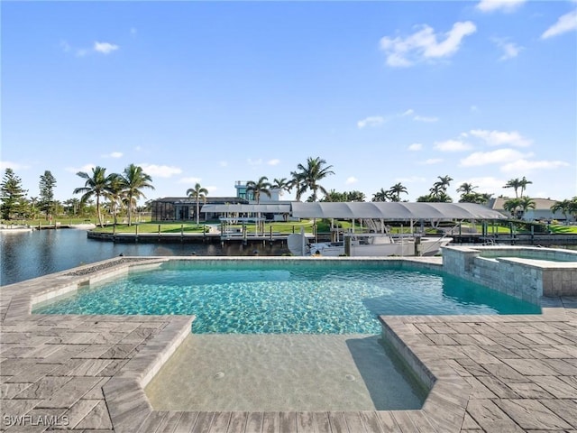 view of swimming pool with a pool with connected hot tub and a water view