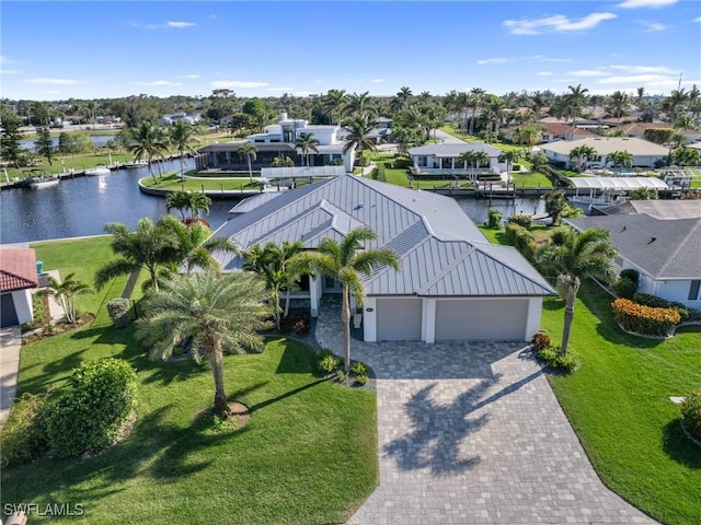 birds eye view of property featuring a water view and a residential view