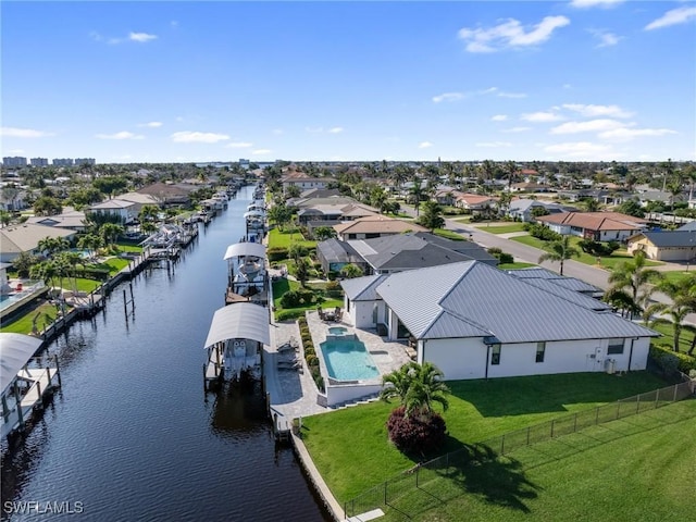 aerial view with a water view and a residential view