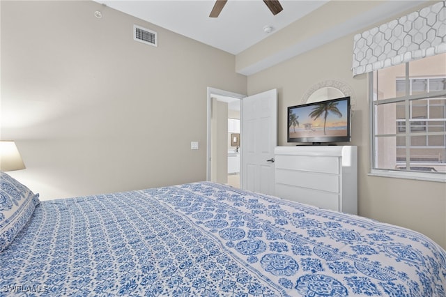 bedroom with a ceiling fan and visible vents