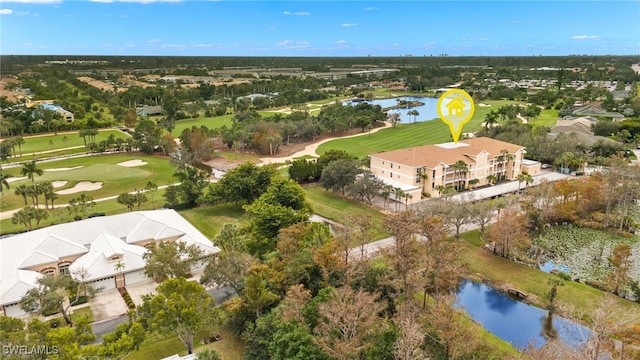 birds eye view of property with a water view and view of golf course