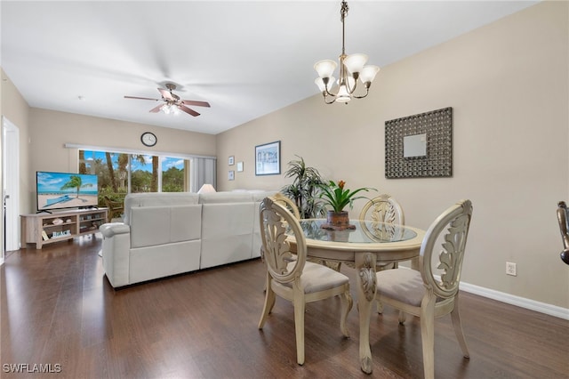 dining room with baseboards, dark wood finished floors, and ceiling fan with notable chandelier