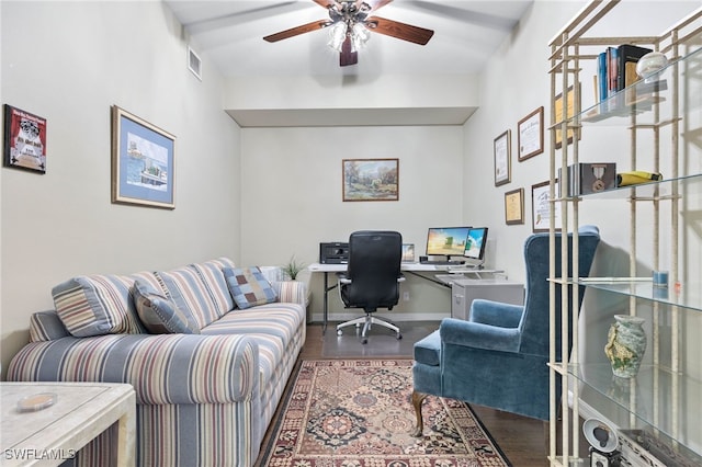 office with a ceiling fan, visible vents, baseboards, and wood finished floors