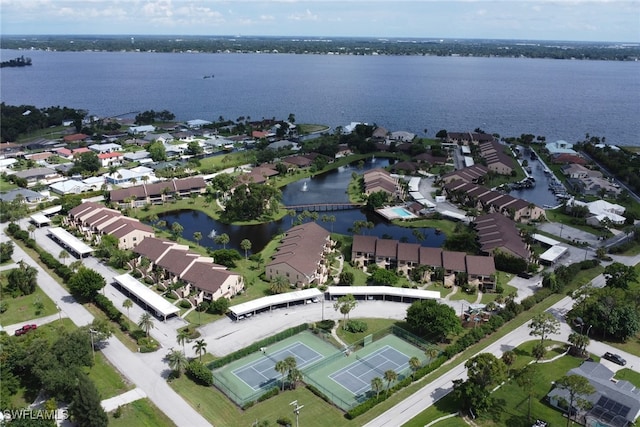 drone / aerial view featuring a water view and a residential view