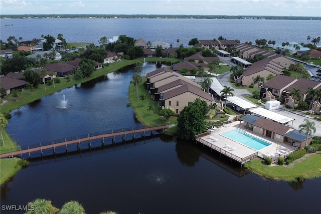 birds eye view of property featuring a residential view and a water view