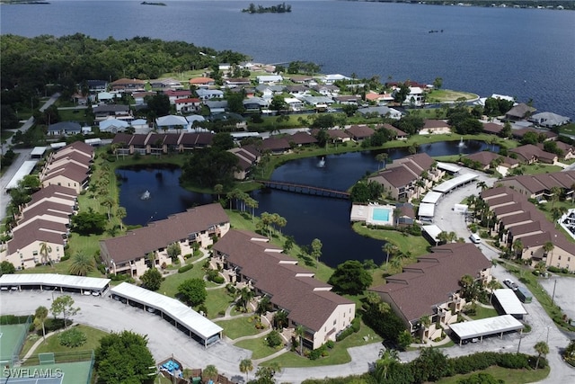 bird's eye view with a water view and a residential view