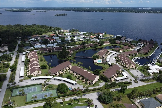 bird's eye view featuring a water view and a residential view