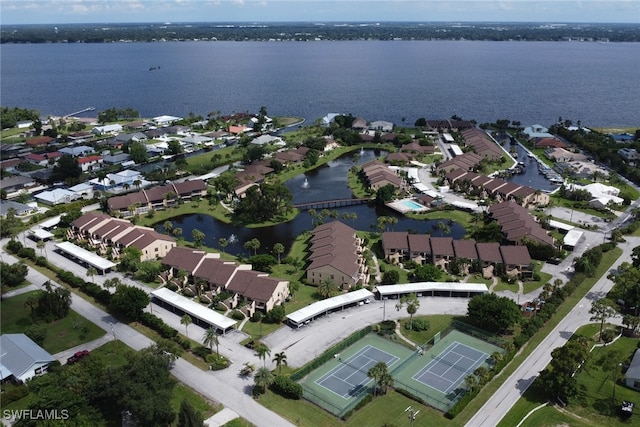 drone / aerial view featuring a residential view and a water view