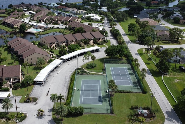 drone / aerial view featuring a water view and a residential view