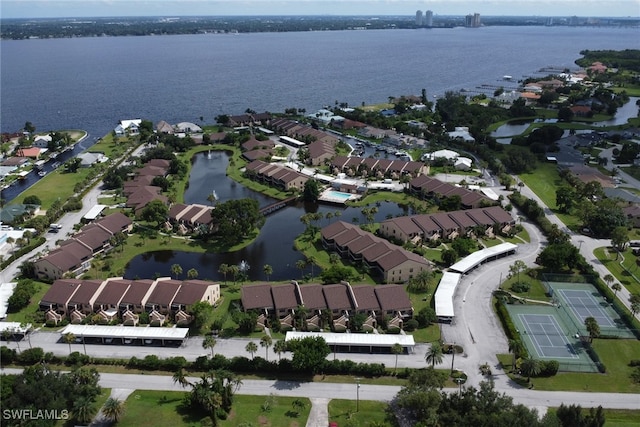 birds eye view of property featuring a water view and a residential view