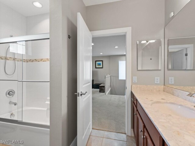 bathroom with tile patterned flooring, shower / bath combination with glass door, vanity, and recessed lighting