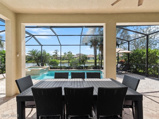 view of patio with a pool with connected hot tub and glass enclosure