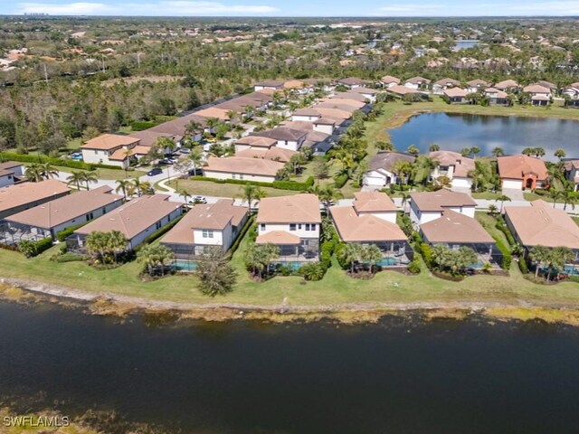 aerial view with a residential view and a water view