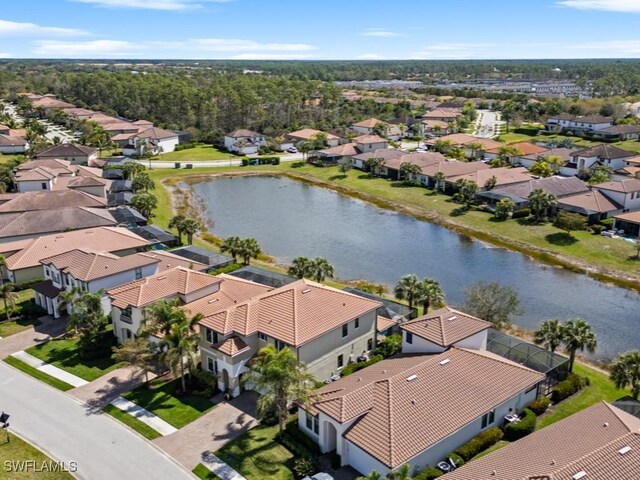 aerial view featuring a residential view and a water view