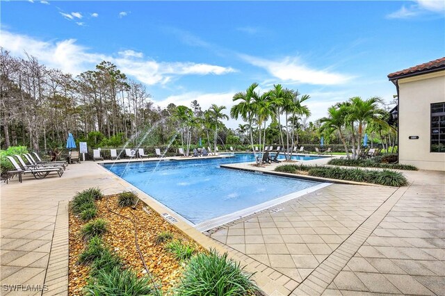 community pool with a patio