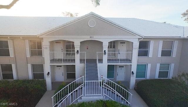 view of property featuring stairs