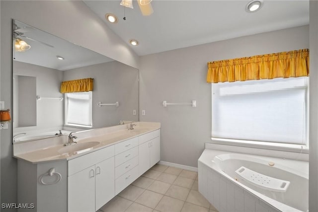 bathroom with a ceiling fan, a wealth of natural light, and a sink