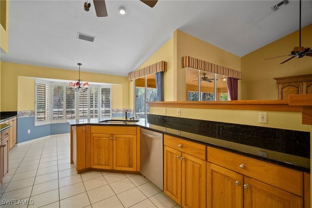 kitchen featuring a sink, visible vents, stainless steel dishwasher, and lofted ceiling