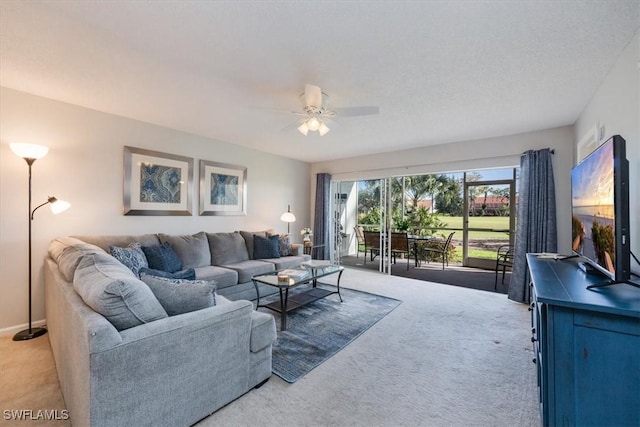 living room with carpet and ceiling fan