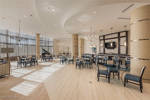 dining space featuring recessed lighting and a notable chandelier