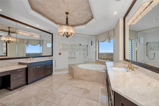 bathroom with a chandelier, a raised ceiling, crown molding, and a sink