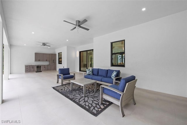 living room featuring beverage cooler, a ceiling fan, and recessed lighting