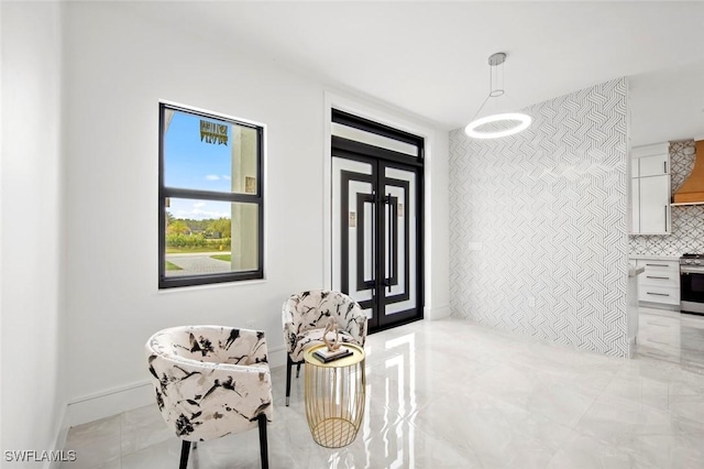 dining area featuring light tile patterned flooring and baseboards