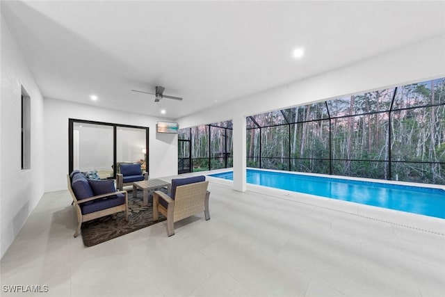 outdoor pool featuring ceiling fan