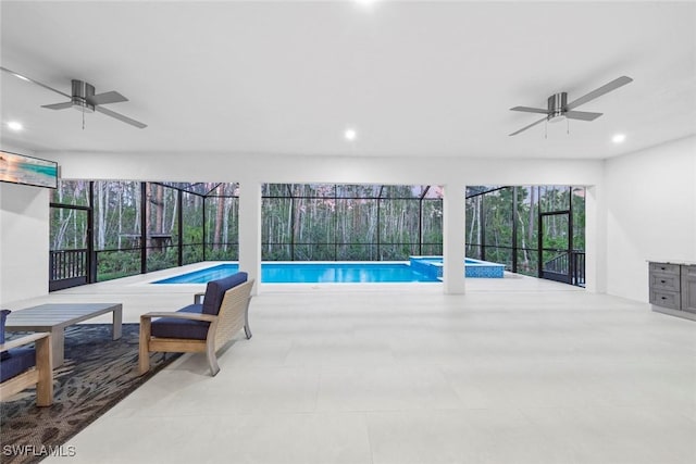 view of swimming pool with a pool with connected hot tub and a ceiling fan