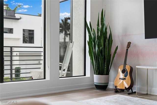 details with wood finished floors and baseboards