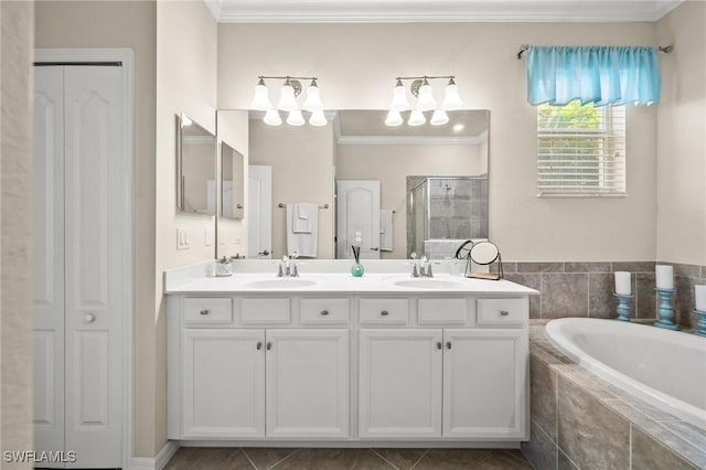 full bathroom with a closet, a shower stall, a bath, and crown molding