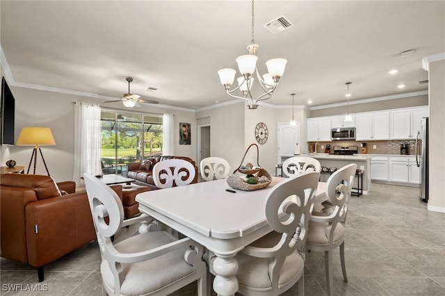 dining room with ceiling fan with notable chandelier, visible vents, and ornamental molding