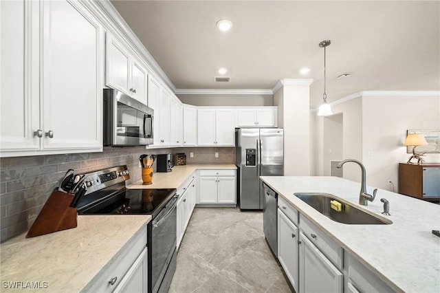 kitchen featuring stainless steel appliances, a sink, visible vents, and white cabinetry