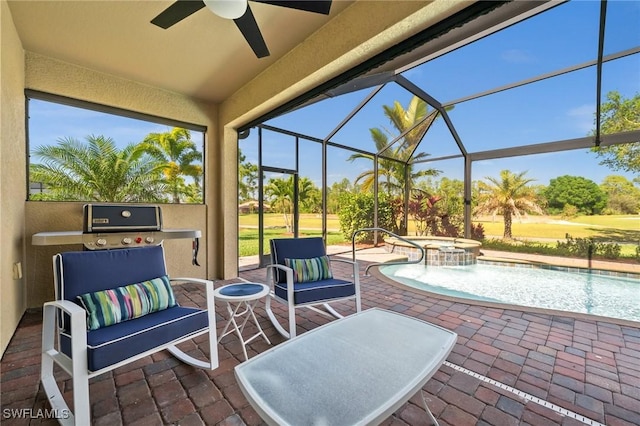 view of patio / terrace with a lanai, a pool with connected hot tub, and a ceiling fan