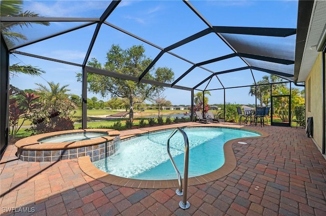 view of swimming pool featuring a patio area, a lanai, and a pool with connected hot tub