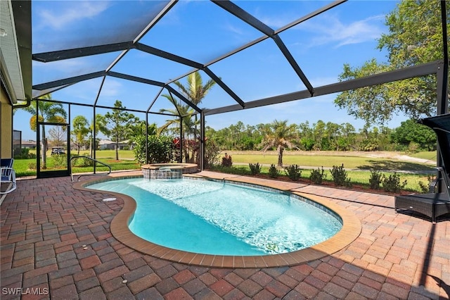 view of swimming pool with glass enclosure, a yard, a patio area, and a pool with connected hot tub