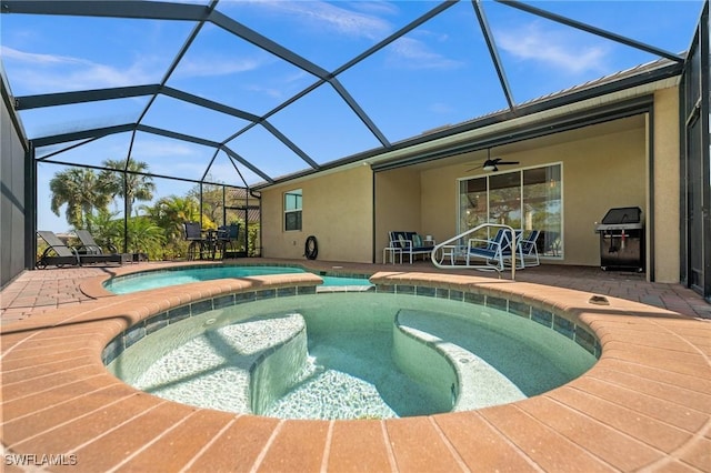 view of swimming pool with a patio area, ceiling fan, area for grilling, and a pool with connected hot tub