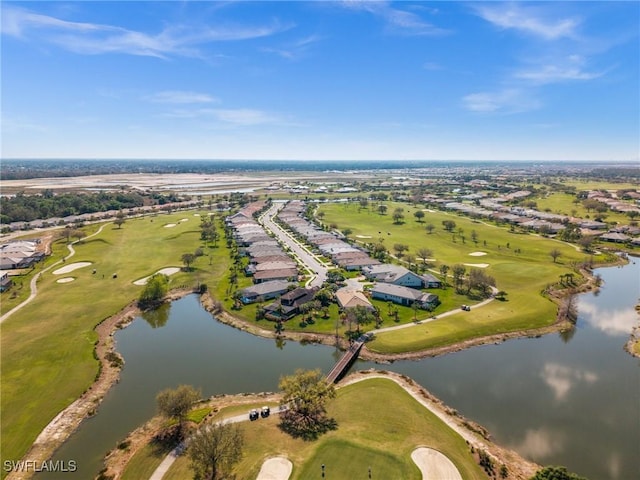 bird's eye view with a water view and golf course view