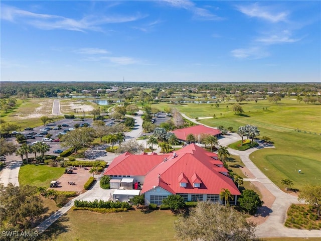 aerial view with a water view and golf course view