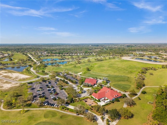 birds eye view of property featuring a water view and golf course view