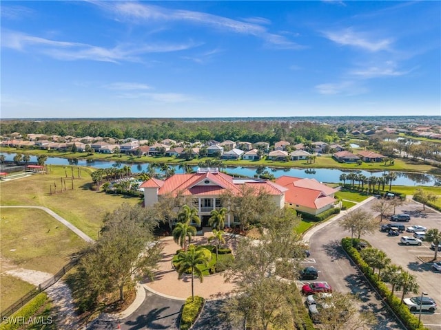 bird's eye view featuring a water view and a residential view