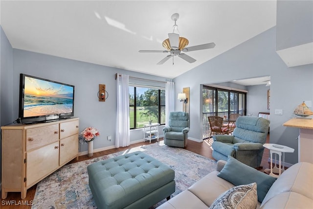 living room with lofted ceiling, baseboards, a ceiling fan, and wood finished floors