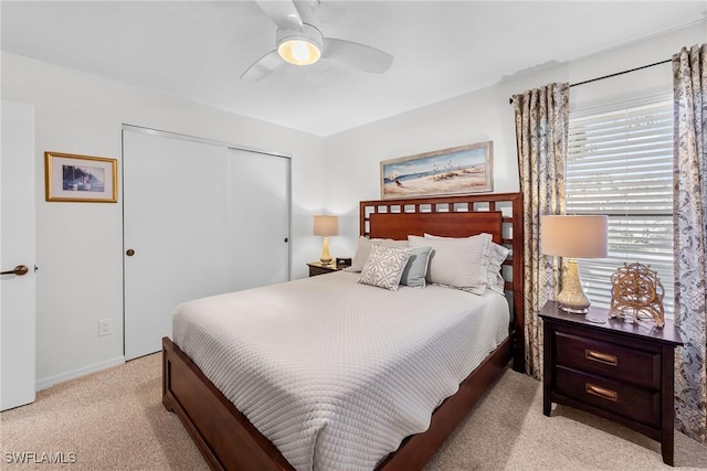 bedroom featuring a closet, carpet flooring, and a ceiling fan